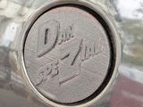 a close up of a car ' s emblem on the side of the car