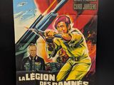 movie poster of a man holding a gun in front of a black background