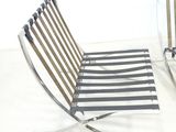 two chairs that are sitting next to each other on the floor
