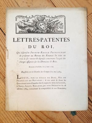 an old book sitting on top of a wooden table