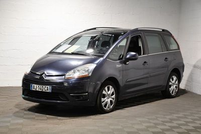grey citroen van parked in a garage with checkered floor