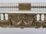 a close up view of a gold plated table top