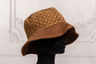 the hat is brown and brown with a pattern on it