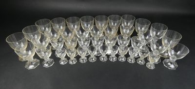 a close up of a bunch of wine glasses on a table