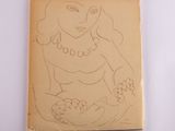 un vieux livre sur lequel figure le dessin d'une femme