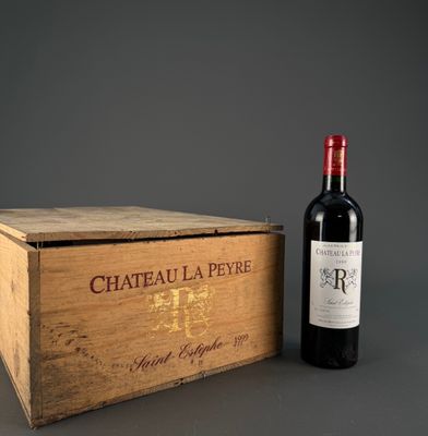 a wooden box with a bottle of wine next to it
