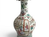 a vase that is sitting on a white surface