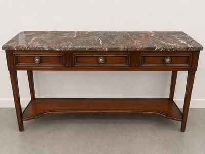 une console avec un plateau en marbre et deux tiroirs