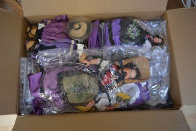 a cardboard box filled with assorted items for sale