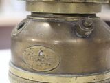 a small brass lantern sitting on a white table