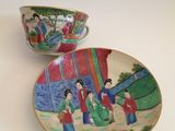 two bowls and a saucer sitting on a table