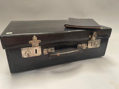 a black suitcase sitting on top of a white table