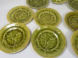 many plates with different designs on them on a table
