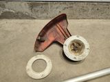a metal pipe and a metal pipe holder on the ground