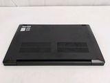 a black laptop sitting on a white surface