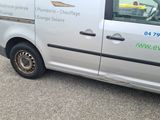 a silver van that is parked on the side of the road