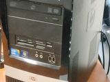 a desktop computer sitting on top of a wooden desk