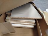 a cardboard box full of cardboard and cardboard sheets