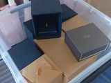 a plastic container filled with boxes on top of a table