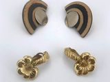 three pairs of gold and black enamel ear clips