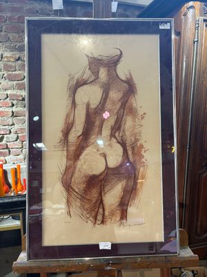 a picture of a drawing of a nude woman on a easel