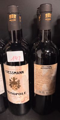 several bottles of red wine are lined up on a shelf