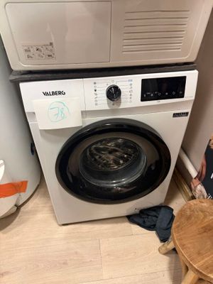 a washer and a dryer in a small room