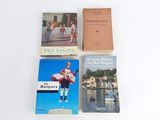 three books are sitting on a table next to each other