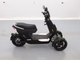 a scooter that is parked in a room