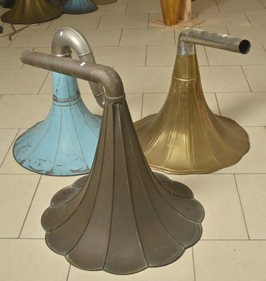 three vases that are sitting on the floor next to each other