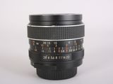 a close up of a camera lens on a white surface