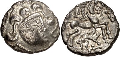 a silver coin with an image of a horse and rider on it