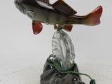 a fish that is sitting on top of a shoe
