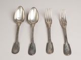 four silver spoons and a fork are lined up on a white surface