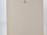 an old photo of a piece of paper with a hole in it