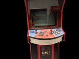une image représentant une petite borne d'arcade aux couleurs rouge et bleue