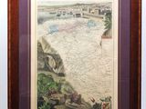 une vieille carte de la ville de New York dans un cadre en bois
