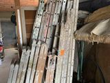 several pieces of wood are stacked on top of each other in a garage