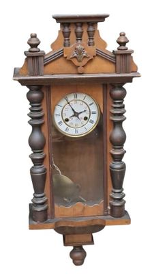 a clock that is hanging on the wall on the wall