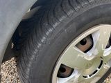 a close up of a car tire on a gravel road