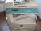 a multi - function printer sitting on top of a tile floor