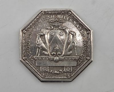 an image of a silver coin with a picture of a lion on it