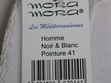 the label on the back of a pair of white pants
