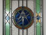 a picture of a stained glass window hanging on a wall