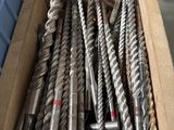a box full of drill bits sitting on a table