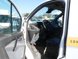a white truck with its door open in a parking lot