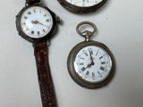 three different types of watches sitting on a table