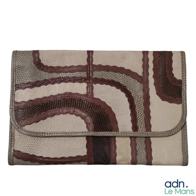 beige, brown, and black clutch bag with a design of wavy lines