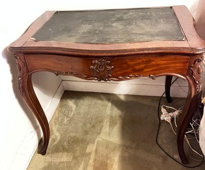 a small table with a marble top in a room