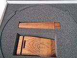 a box with a wooden object inside of it